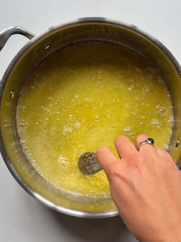 Ghee melting in a metal pot