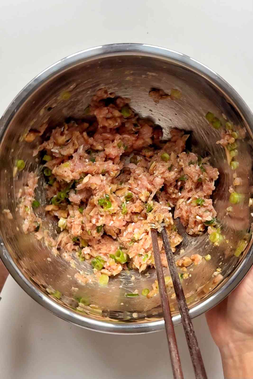 Making the filling for the viral dumpling lasagna.