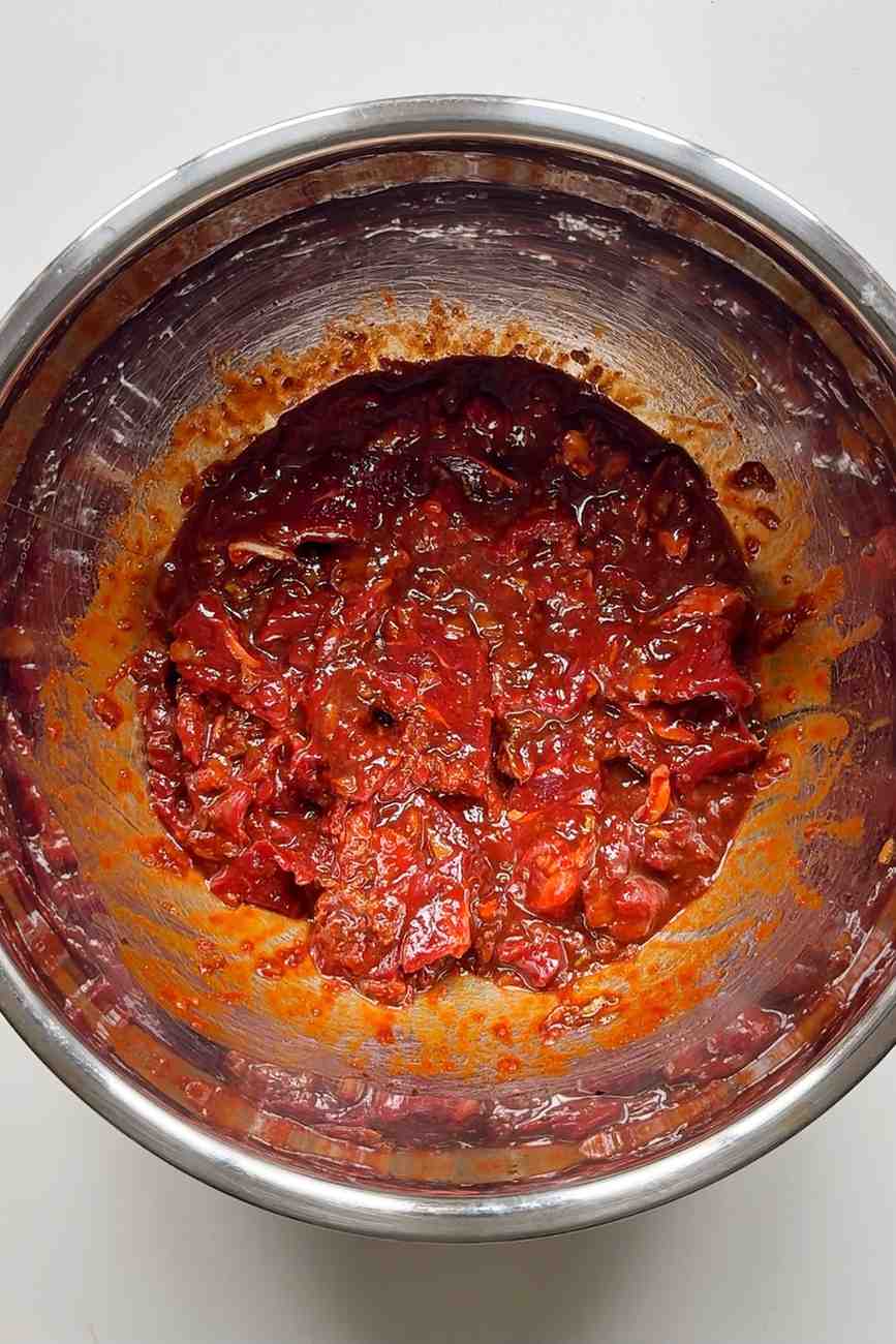 Marinating bulgogi steak in bowl.