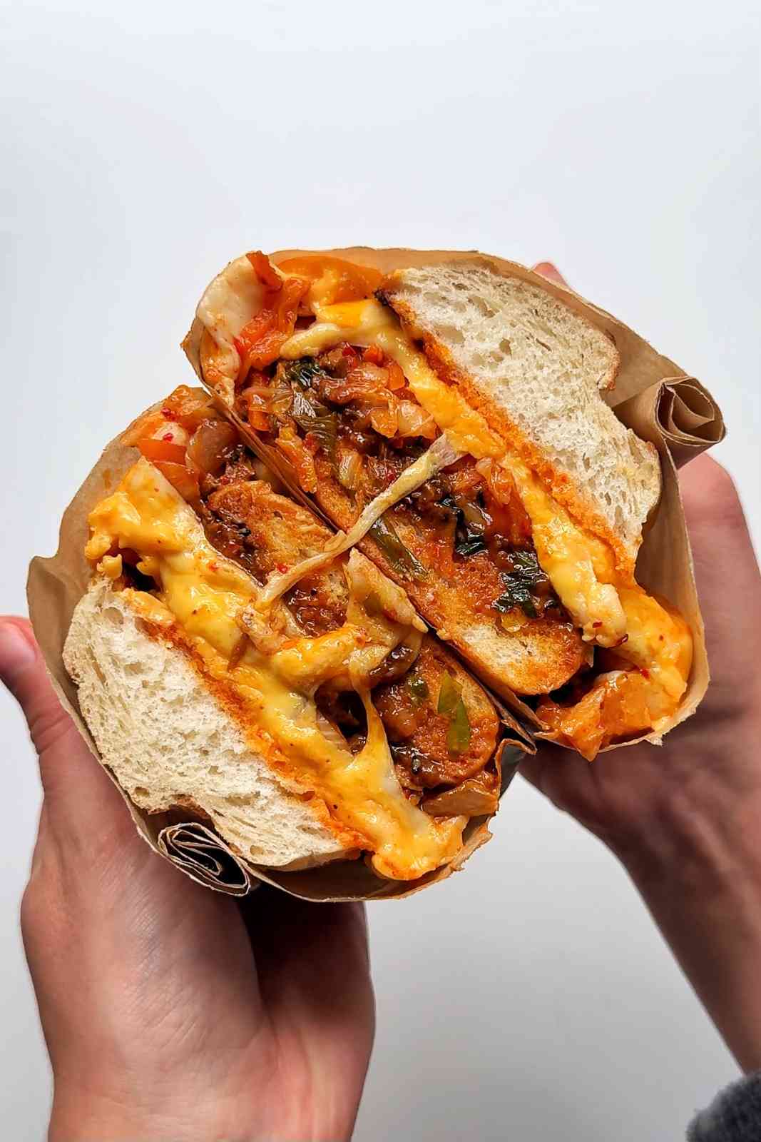 Bulgogi cheesesteak on white background.