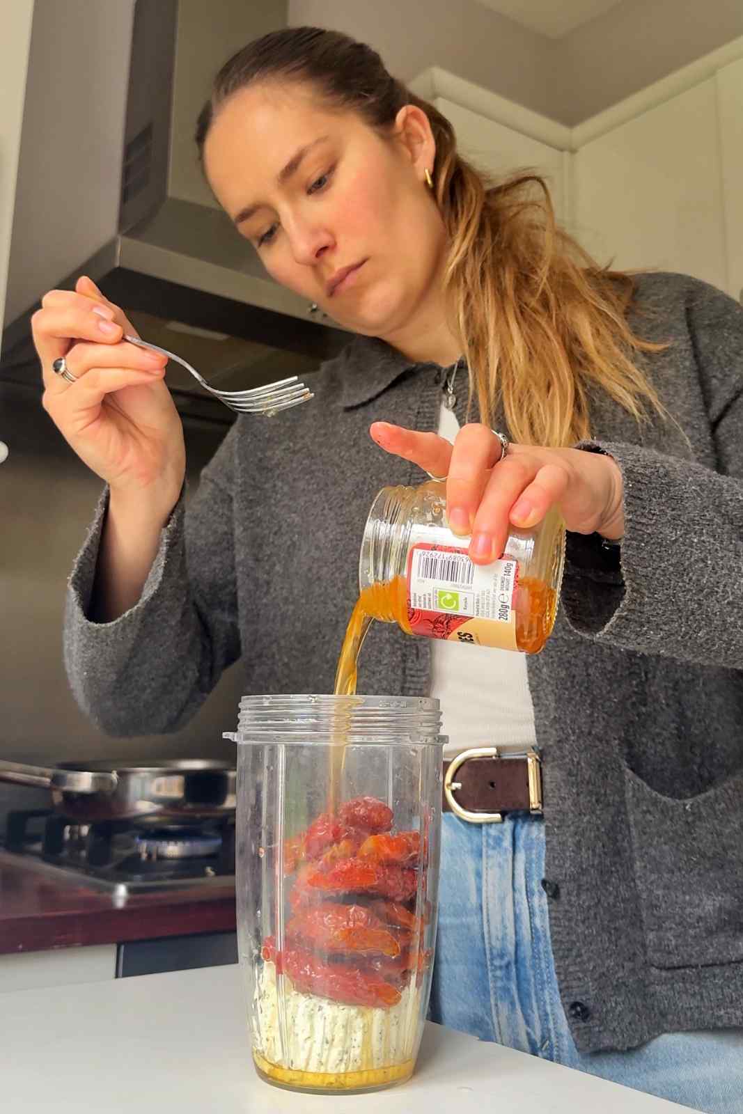 Adding ingredients to a blender.